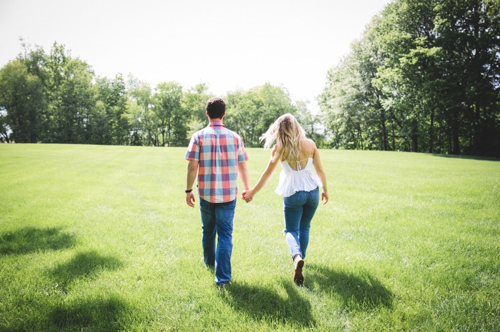 Couple holding hands in the sunshine